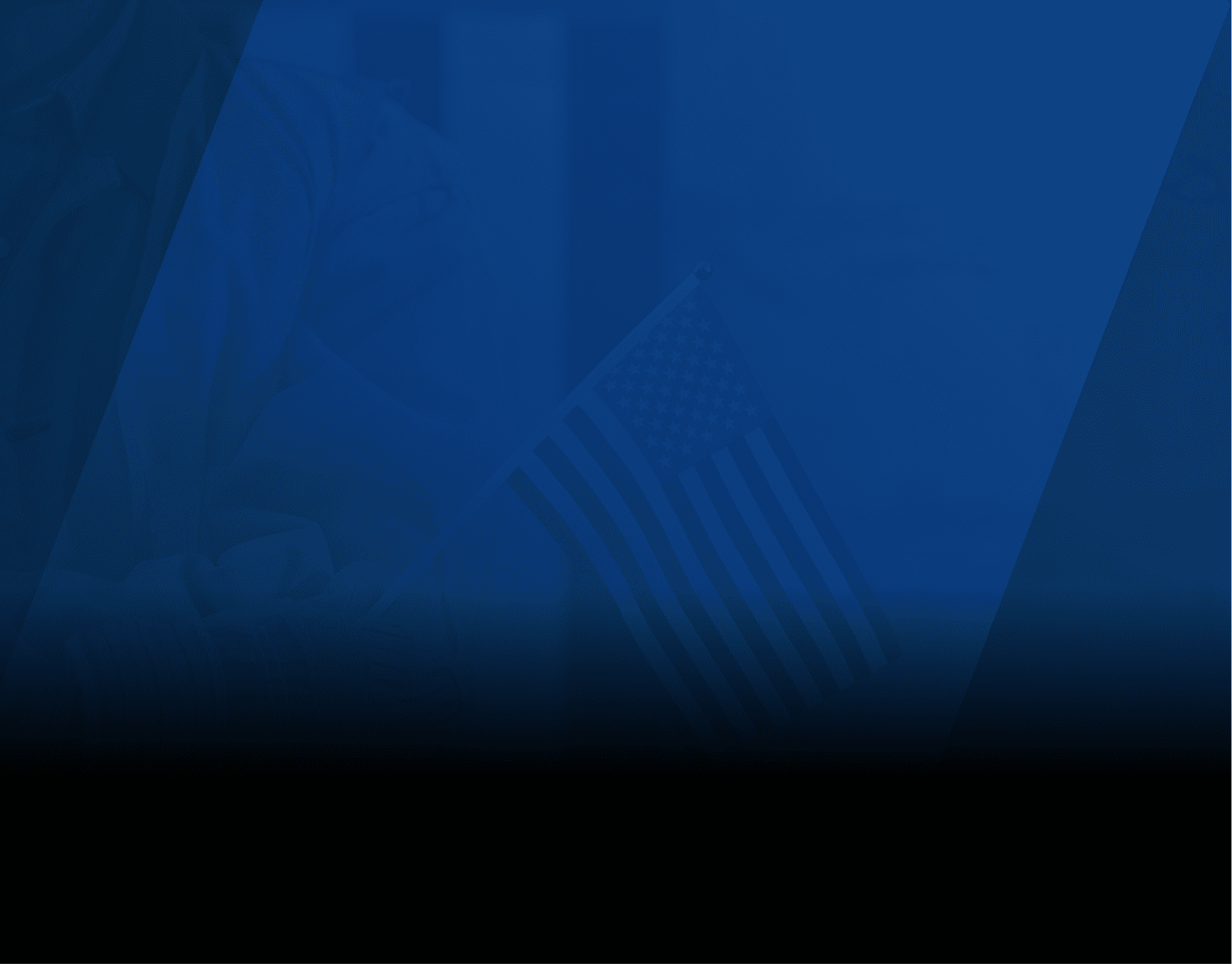 A close-up of a person wearing a white lab coat holding a small American flag on a stick. The background is blurred, focusing attention on the flag and the person's arm.